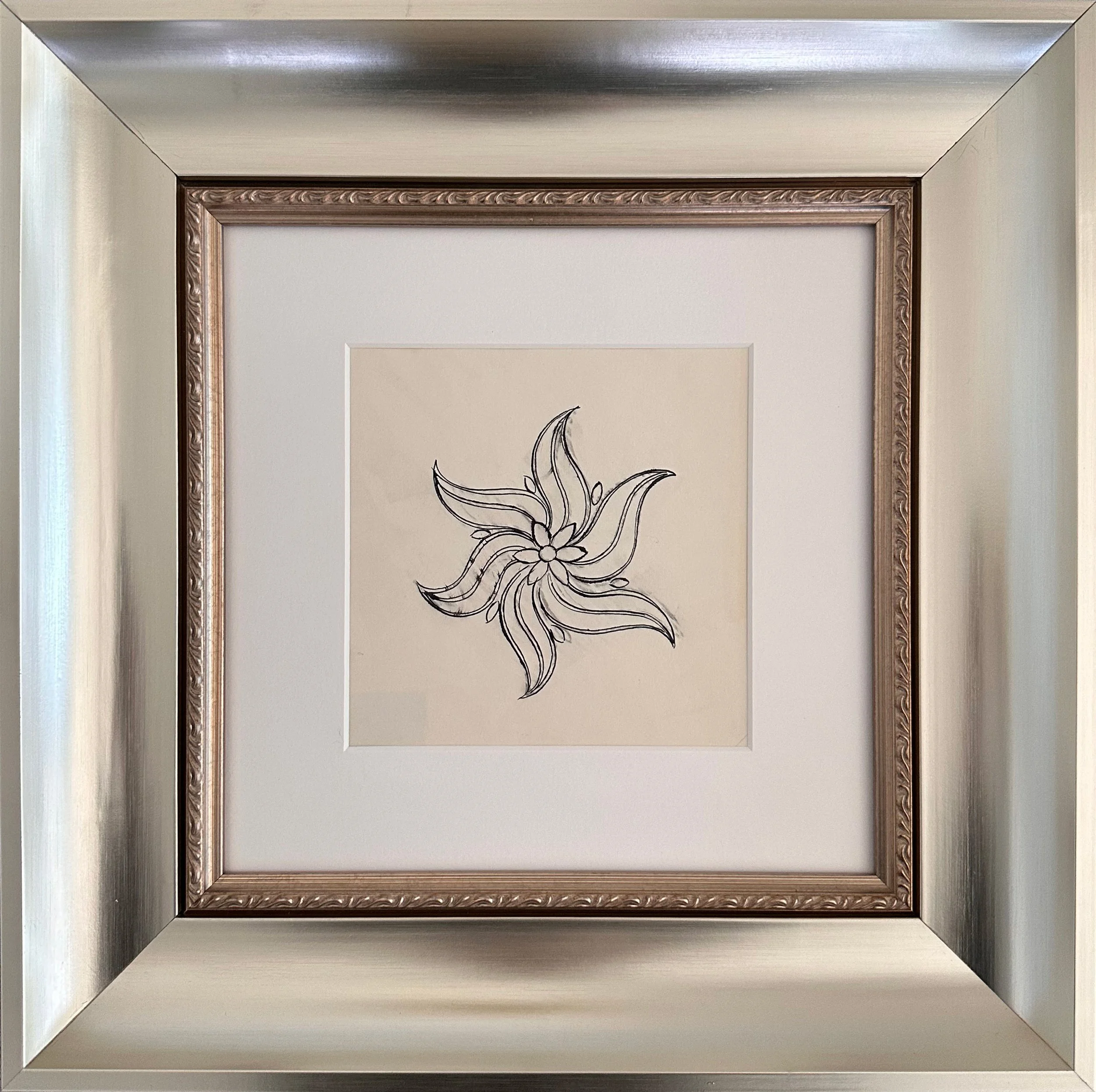 Andy Warhol’s unique ink on paper drawing, Flower, shown here framed.