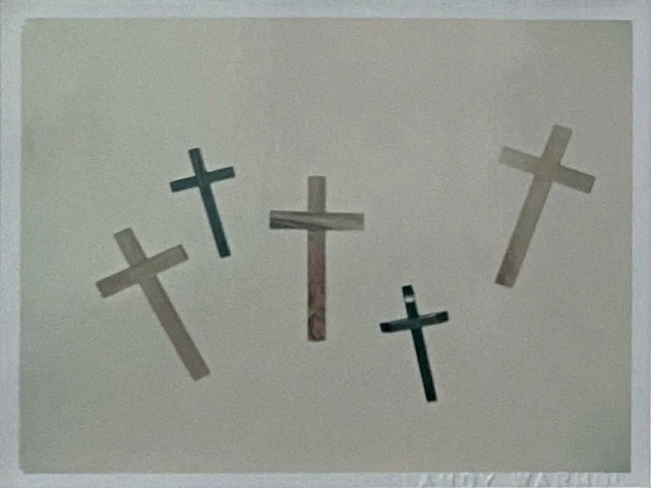A detail image of the lower left Polaroid by Andy Warhol, 'Crosses', shown here unframed.