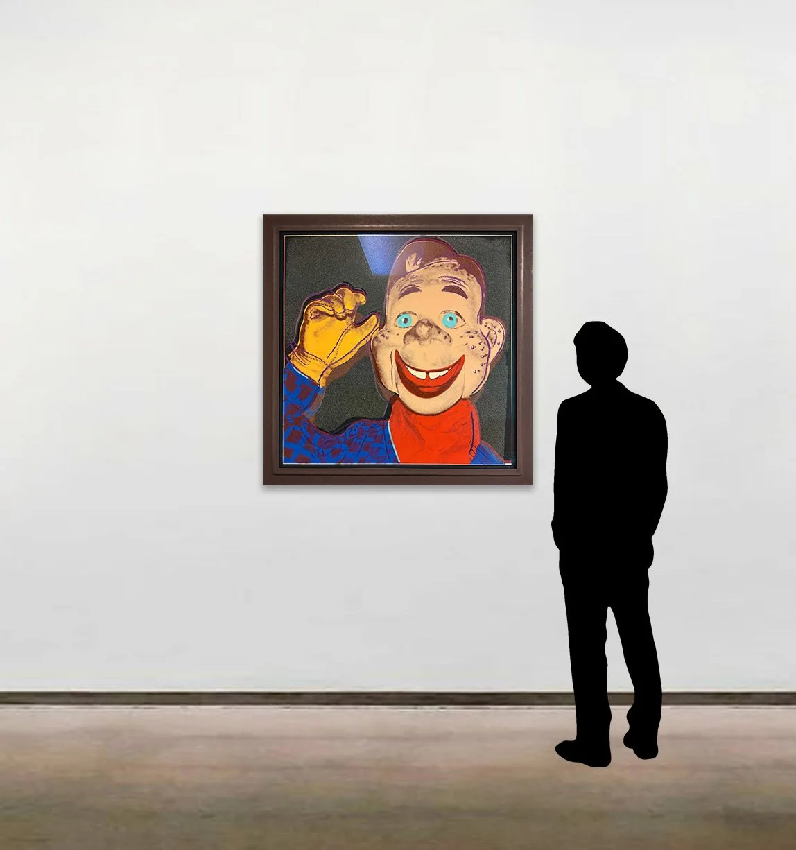 Andy Warhol’s screenprint on Lenox Museum Board, 'Howdy Doody', dated 1981, shown here framed alongside a six-foot figure for scale.