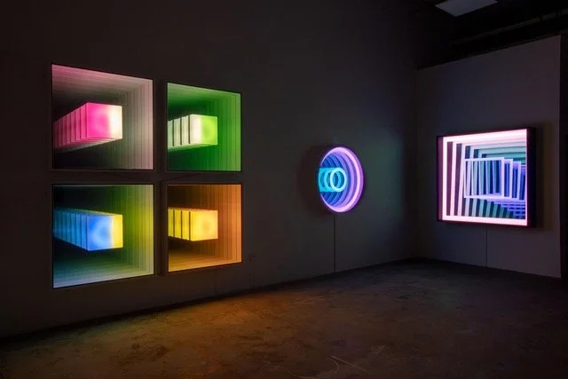 An installation view of Chul Hyun Ahn’s 2024 work, 'Two Squares'. The work, consisting of changing LED lights and mirrors, is pictured here at far right.
