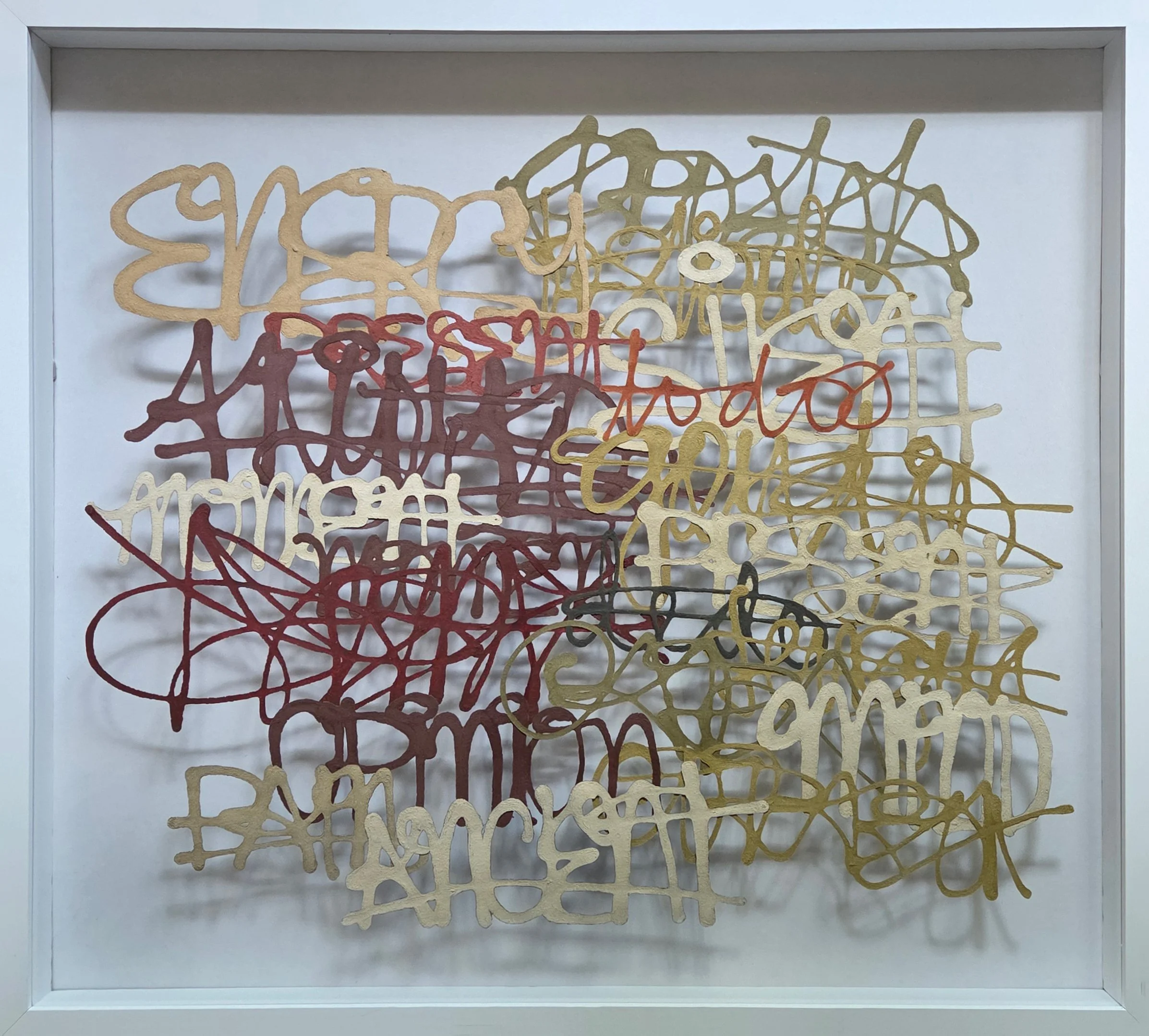Miriam Londoño’s handmade paper work, 'Invasive Words #2', shown here in a white frame.