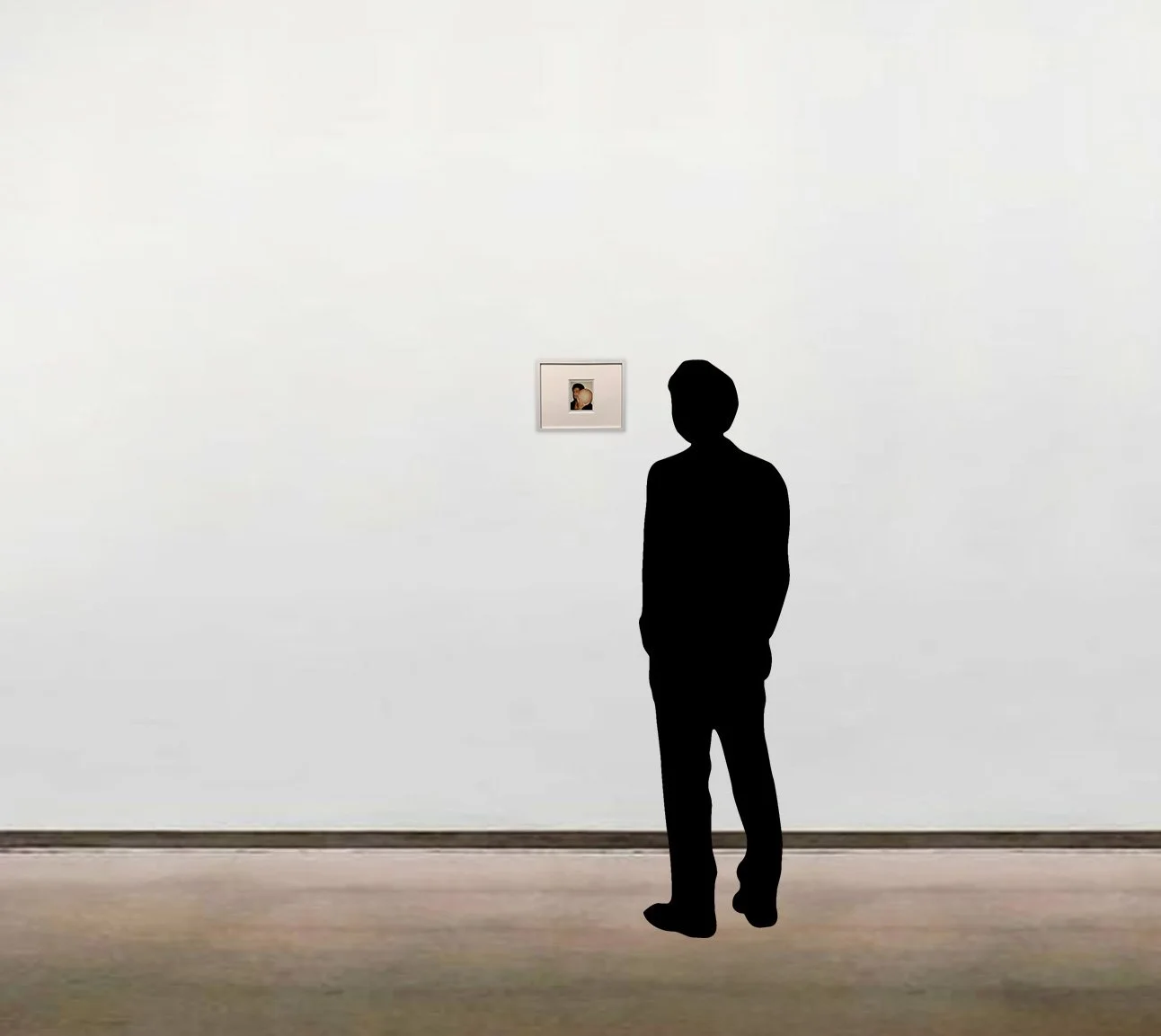 Andy Warhol’s unique Polaroid photograph, 'Kareem', shown here framed alongside a six-foot figure for scale.
