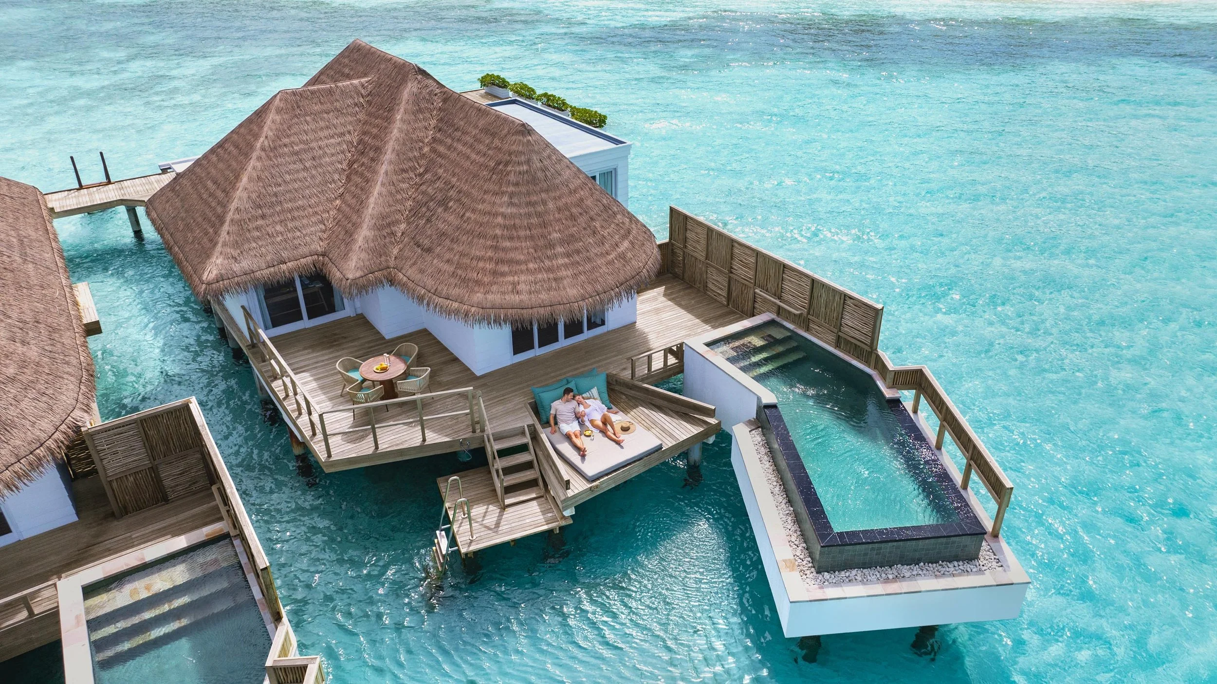 Honeymoon Family Water Villa Pool Aerial Lifestyle 011 V3 16x9.jpg