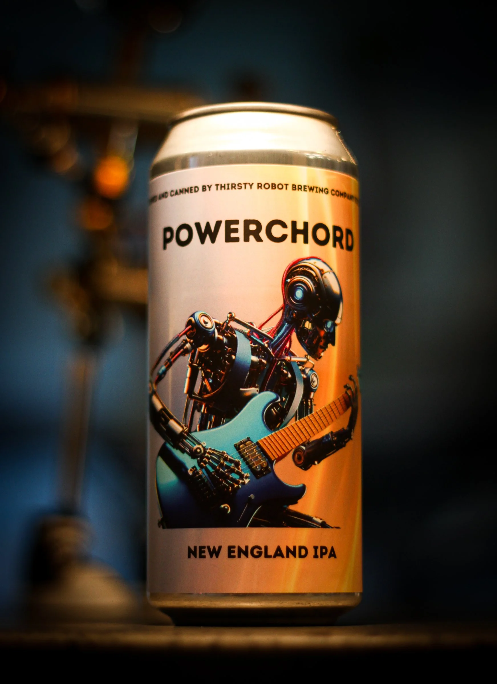 A can of Powerchord New England IPA beer featuring a robot playing an electric guitar.