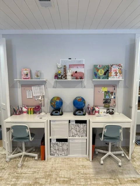 Cubbies labeled (workbooks, journals, finished artwork) so kids follow the system