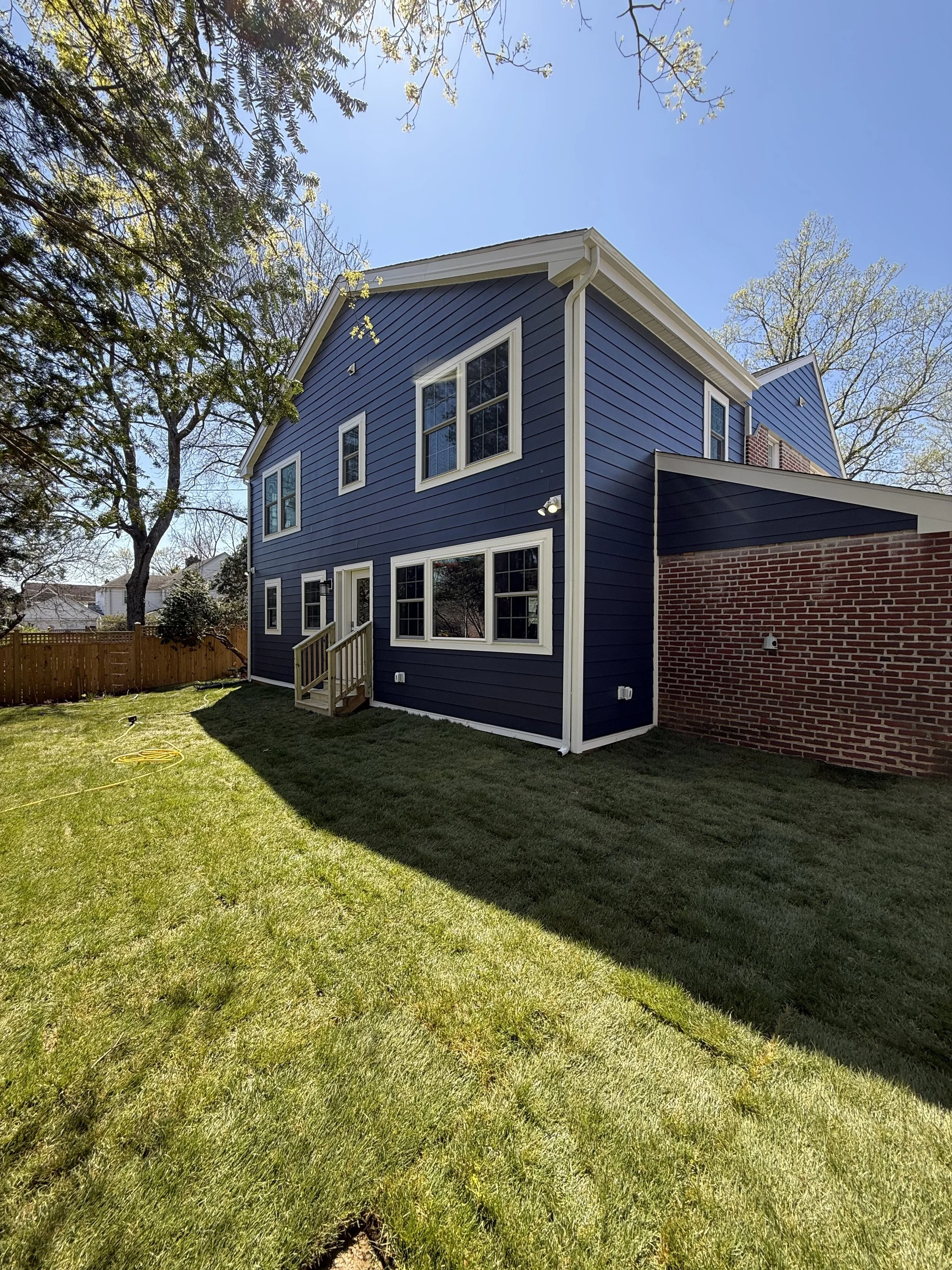 Grey Noll Designs completed a Custom Home Addition to a classic Wynnewood home by expanding the living space, kitchen, guest suite and primary bathroom