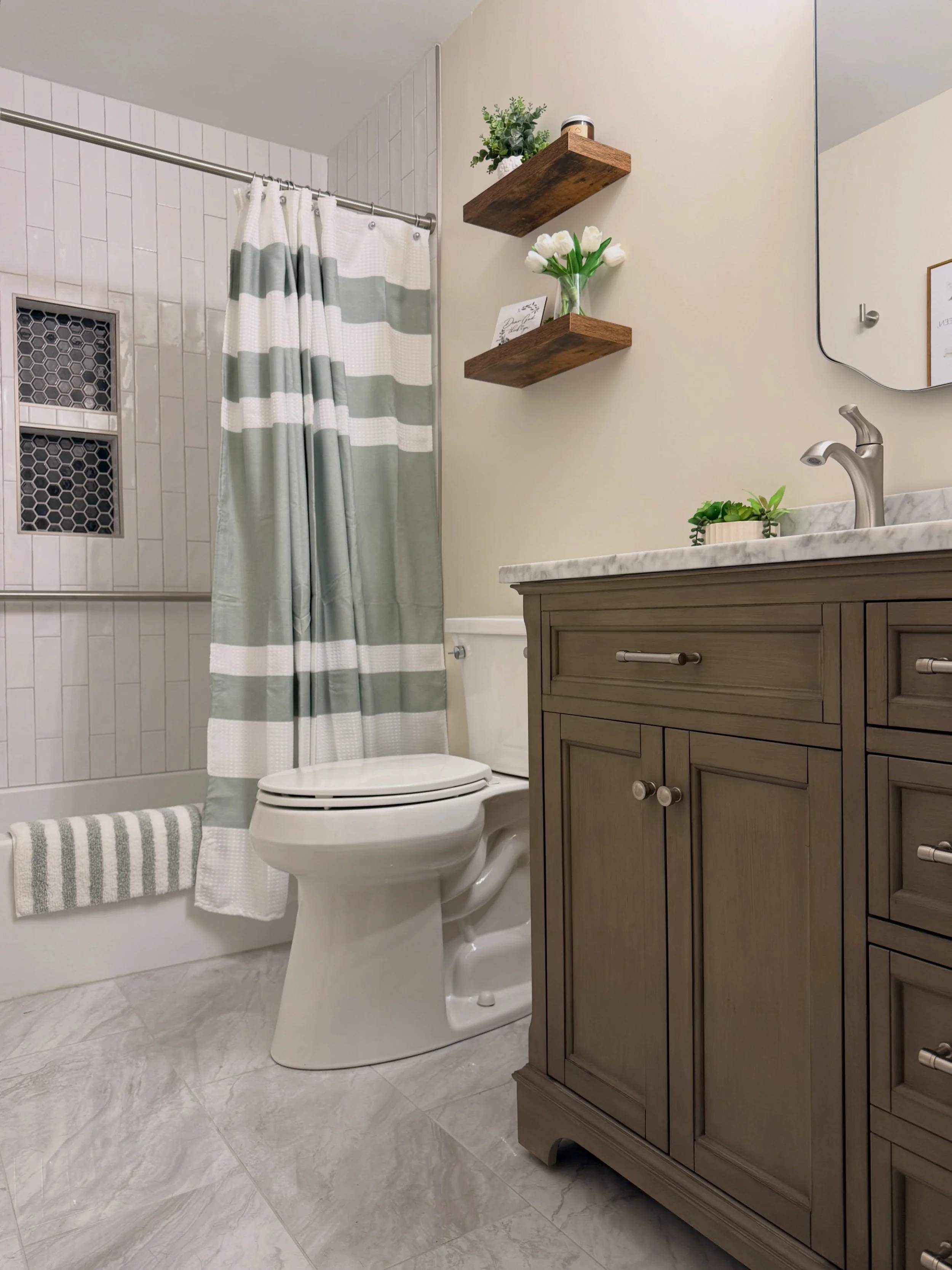 This bathroom renovation in Coatesville, PA took a dated space that needed repairs to a calming guest bathroom that functions for many members of their extended family. 

Timeless materials and careful selections completely changed how the bathroom f