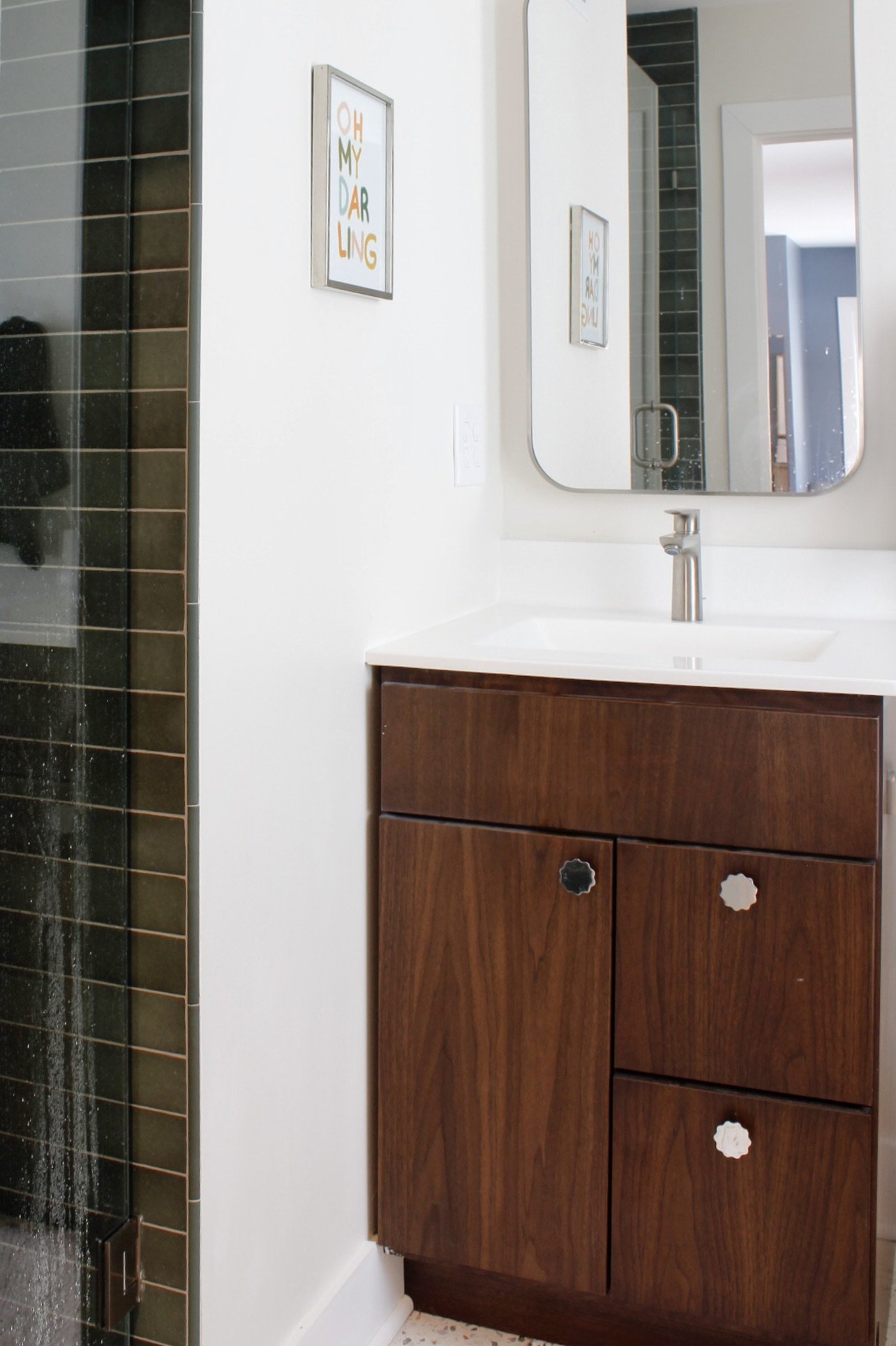 Sage tile shower, walnut vanity with chrome finishes