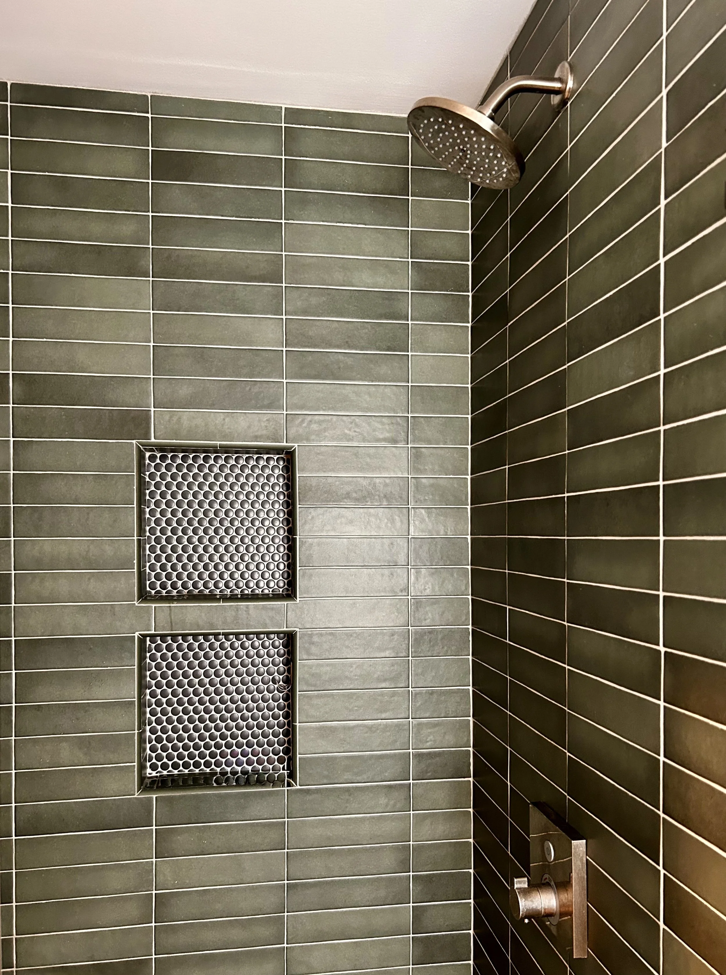 Sage green tile shower, horizontally stacked subway tile, penny tile niches
