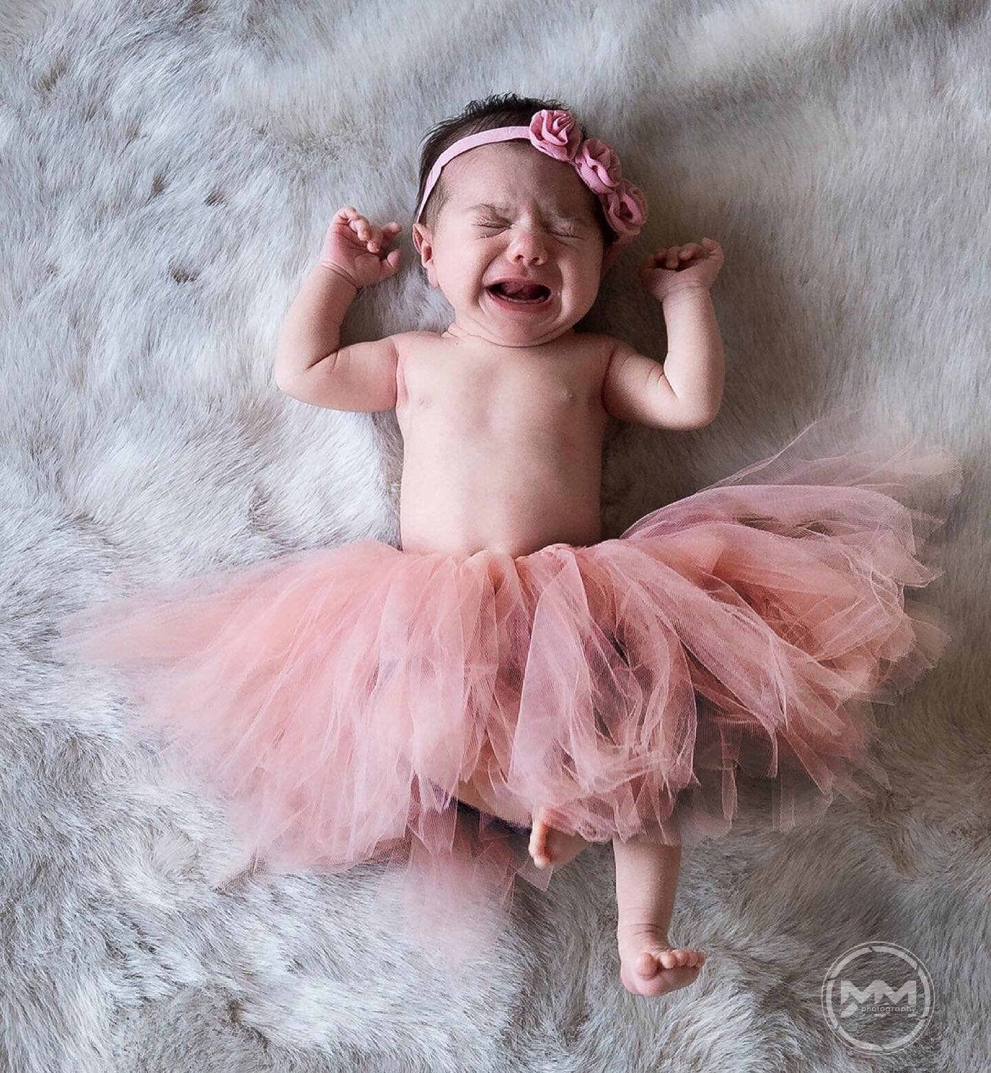 The tutu is rarely their favorite outfit. Newborn babies always have the last word in regards to outfits and styles.  So I only got this shot with the tutu, because Amara definetely said &quot;no tutu!&quot;