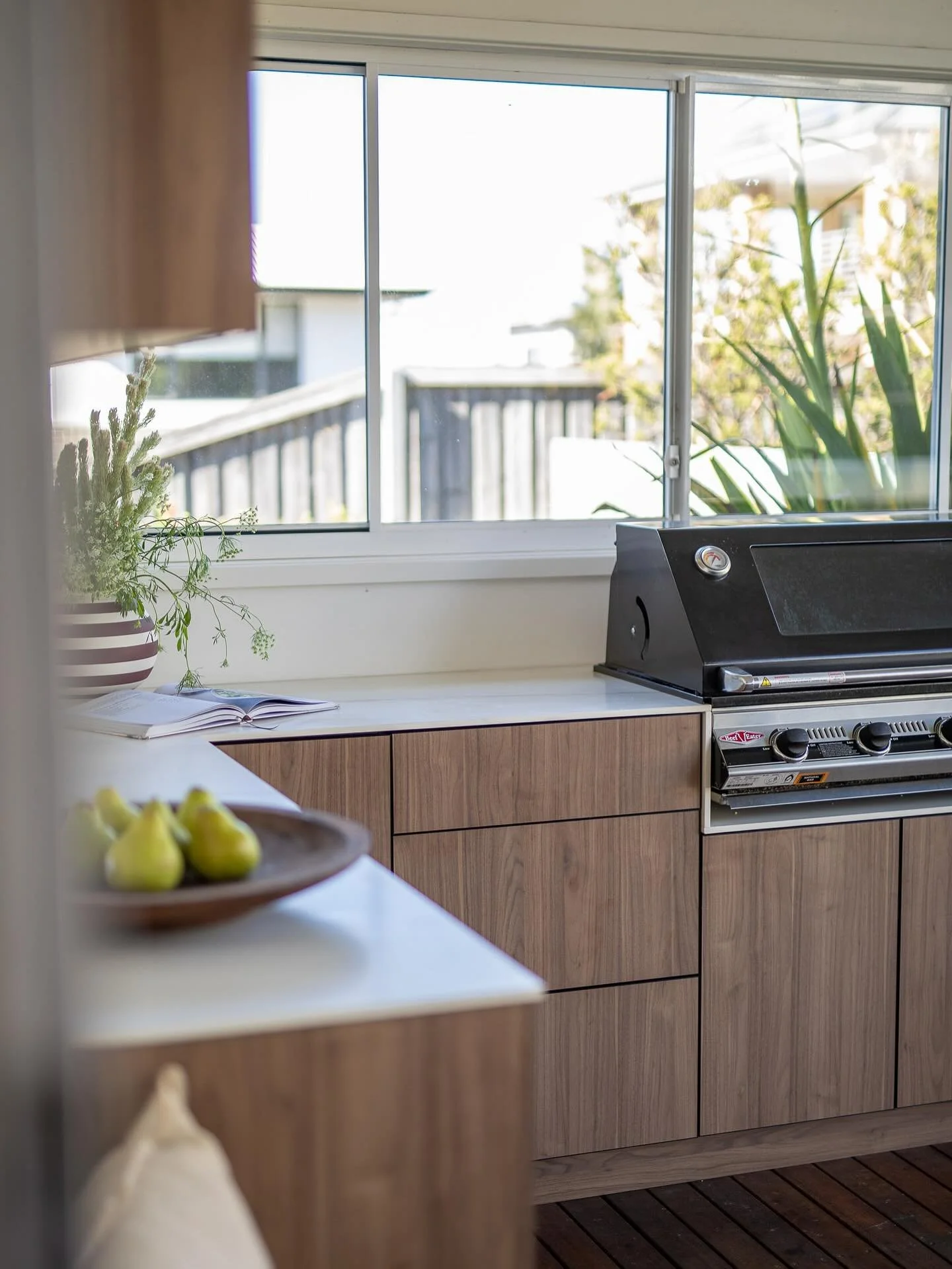 Walnut outside kitchen with delicious chocolate veined stone. A bench seat in faux leather outside fabric and plenty of storage- tick. 

Now for some warmer weather 🤍.#outdoor #kitchen #interiordesign #_cs_interiors_
