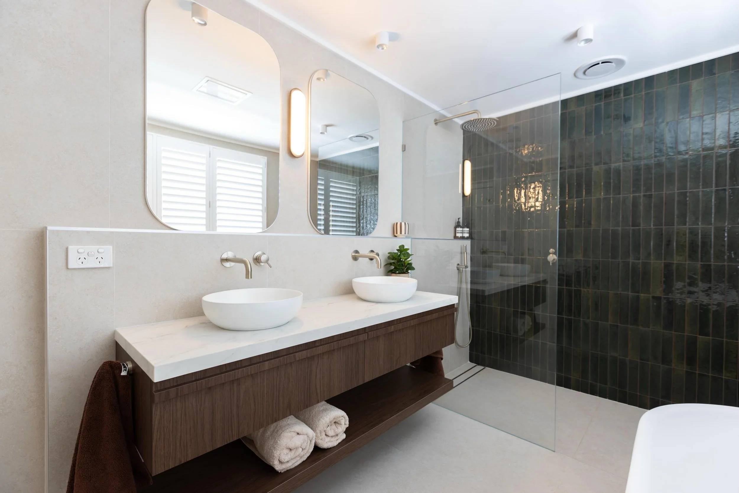 NORTH WOLLONGONG. A little luxury for the teenage years! Emerald green tones, custom joinery, heated towel rails and a beautifully tiled shower seat 🤍.
 
Interior Design @_cs_interiors_ 
Builder @connorbathrooms 
Photography @creative_events_photogr