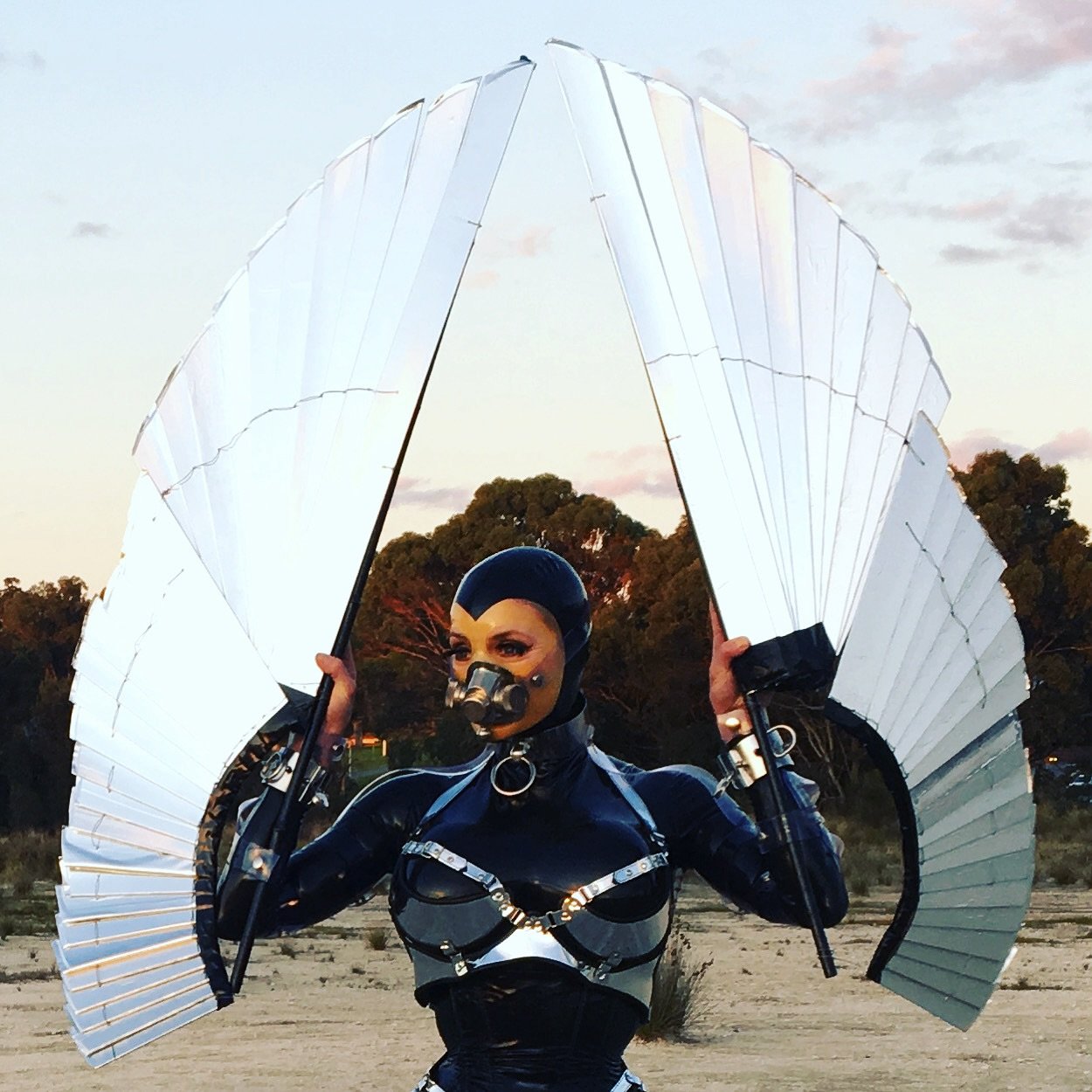 I&rsquo;m flying to Perth Dec 7th to 12th. Image from the vault from Wayne at @warped.photography . I&rsquo;m wearing a @hw_design_latex hood , Fantastic Rubber catsuit and the wings are my own. #mistresstokyo #perth #dominatrix #warpedphotography