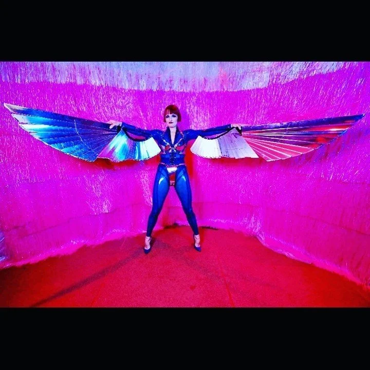 Social Media rebuild; The 1st time I wore My now-infamous silver wings at Kooky at the @sydneyoperahouse - I'm wearing a blue #latex #catsuit of My own manufacture and silver leather bra set! #sydneyoperahouse #costume