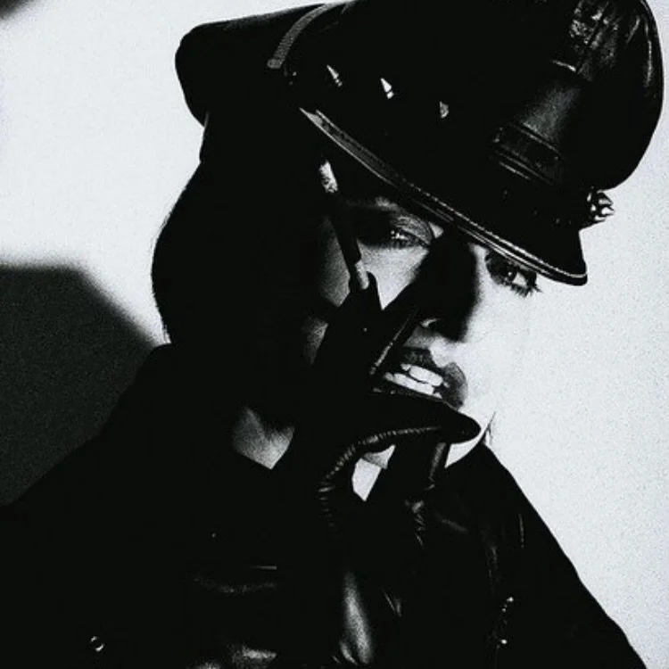 EYES LIKE GUNBARRELS. Shot by @samkingart68 wearing @crazyoutfitsshop #leather #catsuit smoking My favourite Nat Sherman&rsquo;s! #mistresstokyo #sydney