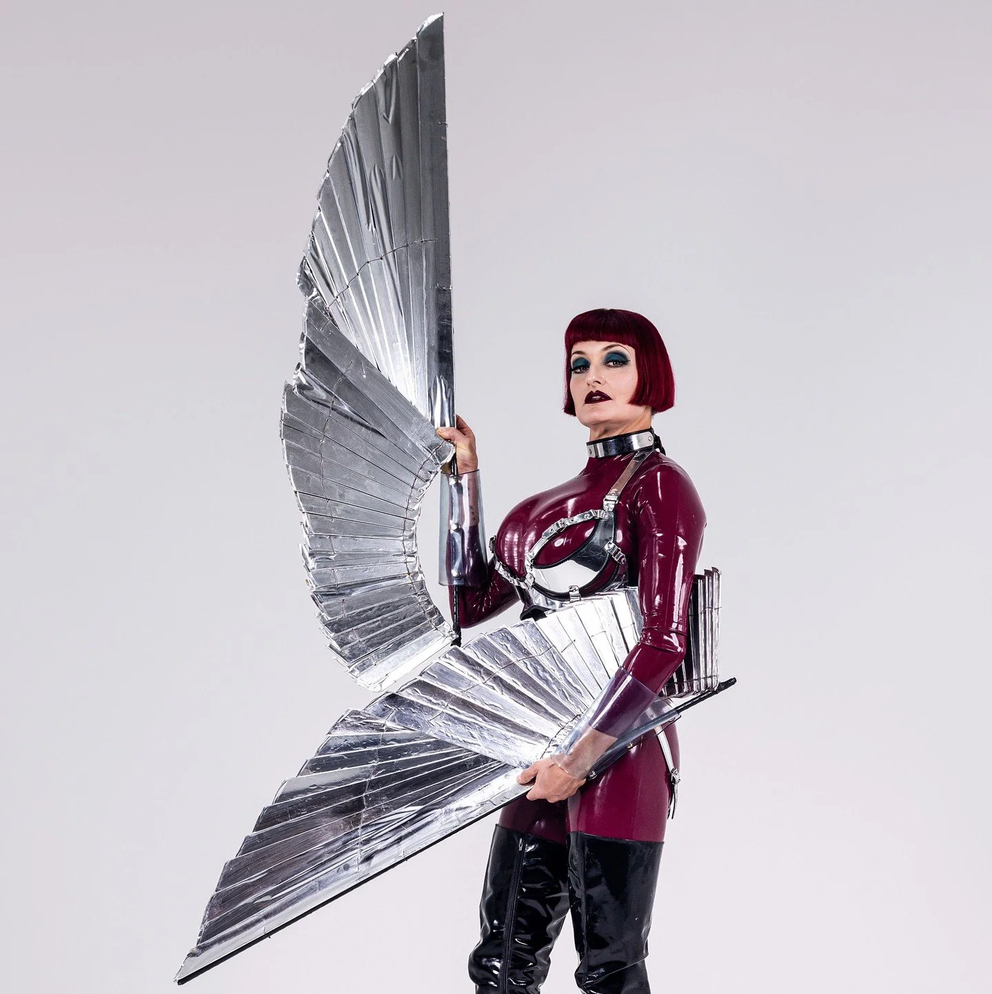 More shots from My 25th Anniversary shoot with @roberto_duran! I'm wearing a @Libidex burgundy #catsuit , a tightlacing #corset by @sue_nice &amp; boots by @iliaslittleshoeboxuk ! The silver wings are by Me! #mistresstokyo #littleshoebox