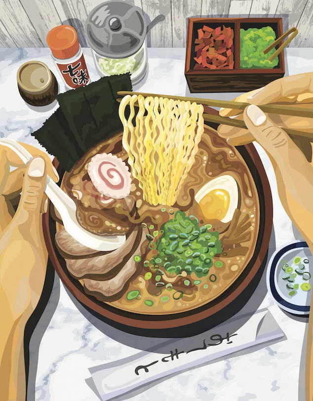 An above view of a ramen bowl on a counter and noodles being lifted up with chopsticks 