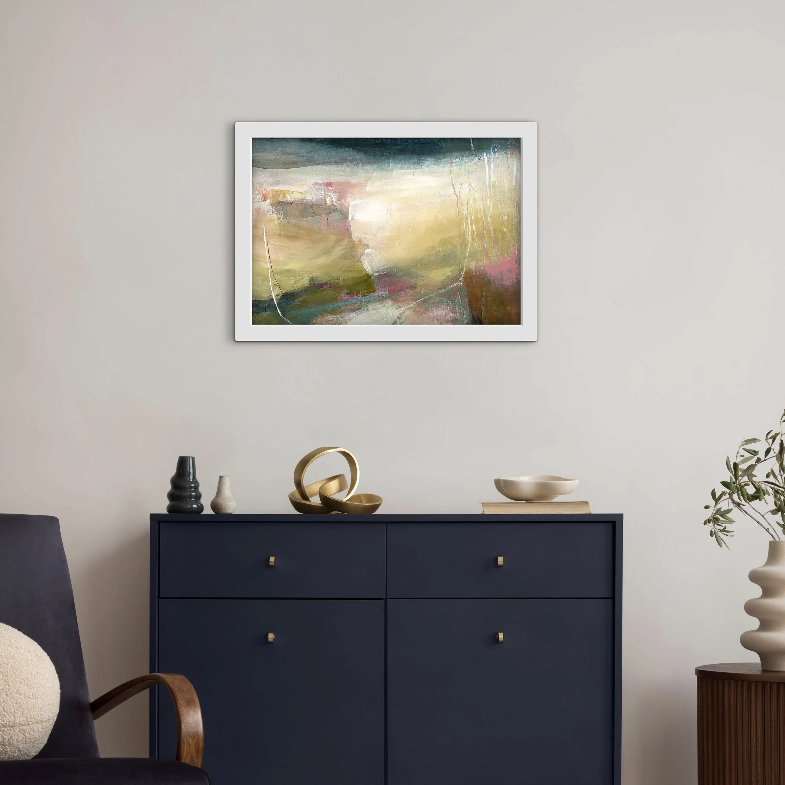 pink and green abstract landscape hung on a light grey wall