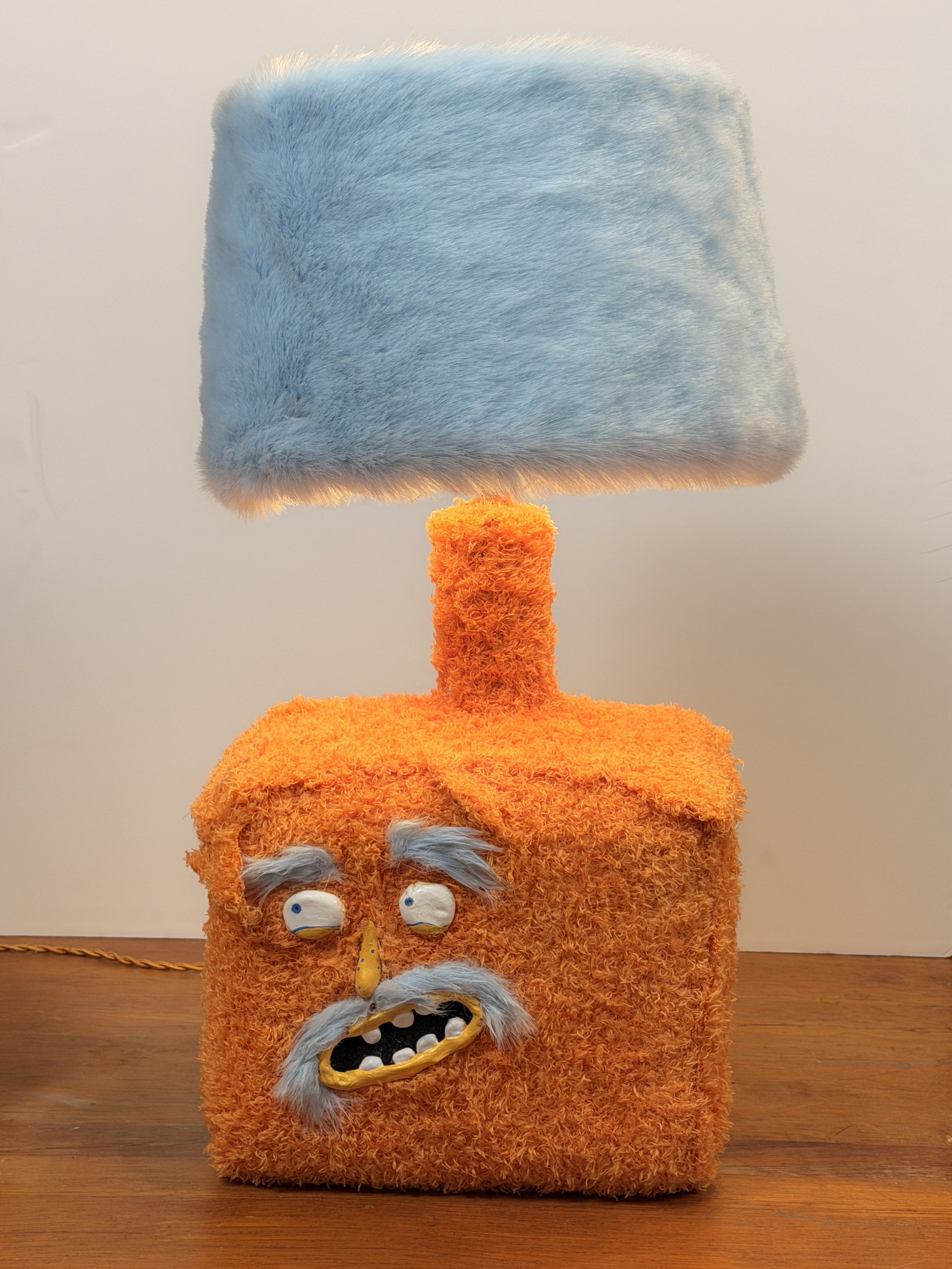 Carlito, handmade character lamp with orange and light blue fur by Barak Hardley