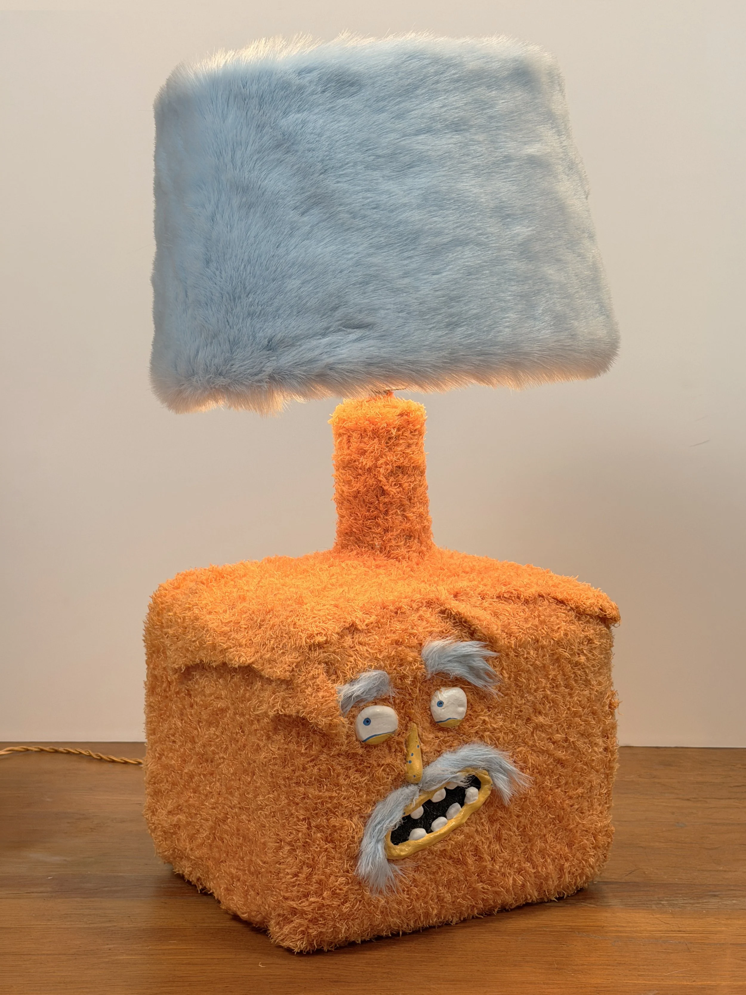 Carlito, handmade character lamp with orange and light blue fur by Barak Hardley