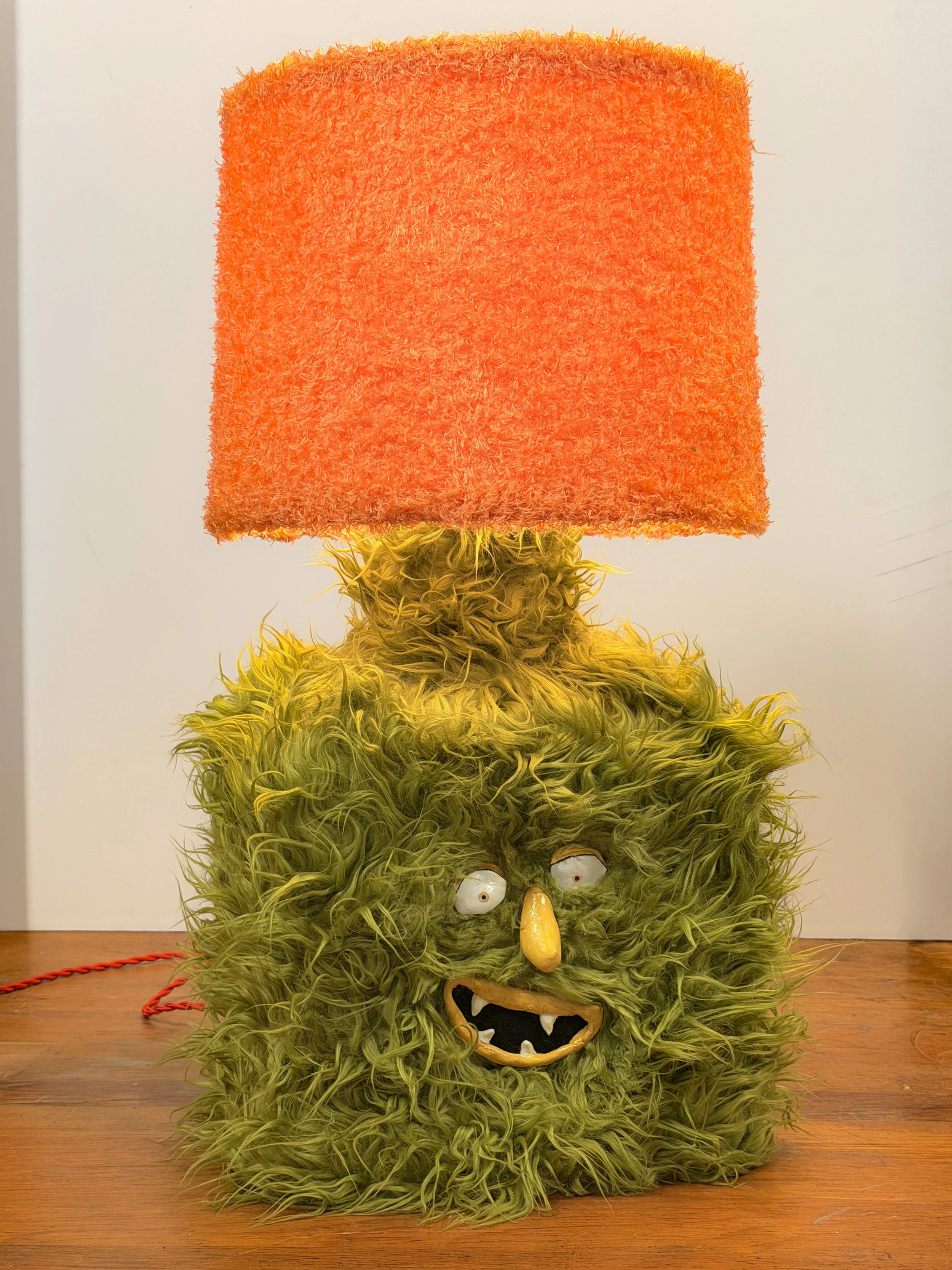 onesy T., handmade werewolf character lamp with green and orange fur, by Barak Hardley