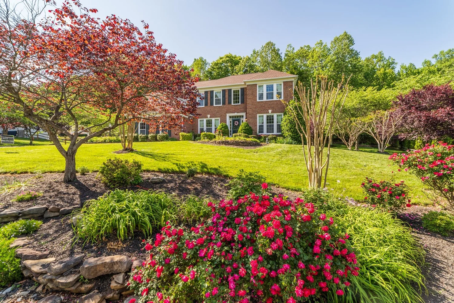 Brick colonial with mature landscaping