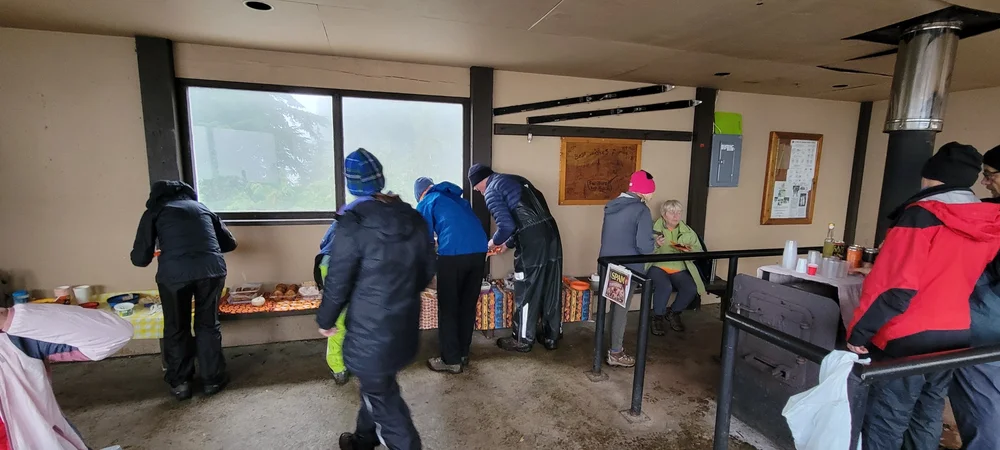 Part of the group at the hut, loading up on food By Rob