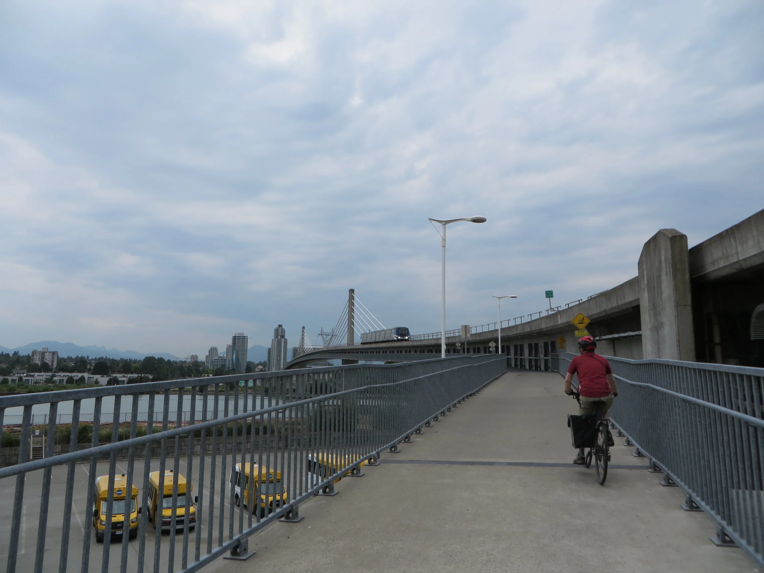 Iain heading north over Canada Line Bridge Photo by Tamsin July 31st 2021