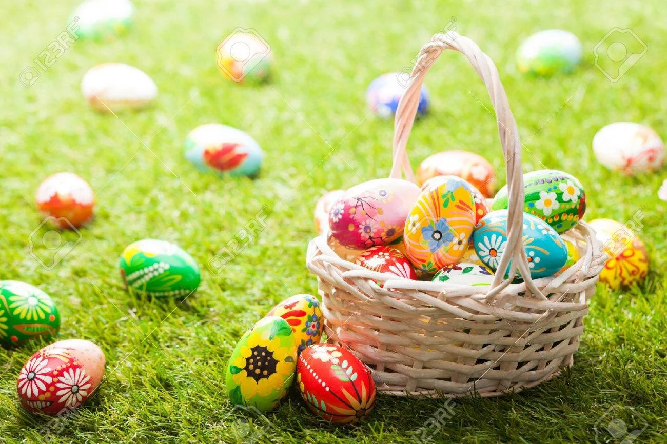 52511614-unique-hand-painted-easter-eggs-in-basket-on-grass-traditional-decoration-in-sun-light.jpg