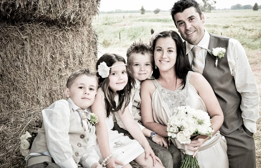 Lisa and Boots on their wedding day with their blended family of two sons and a daughter