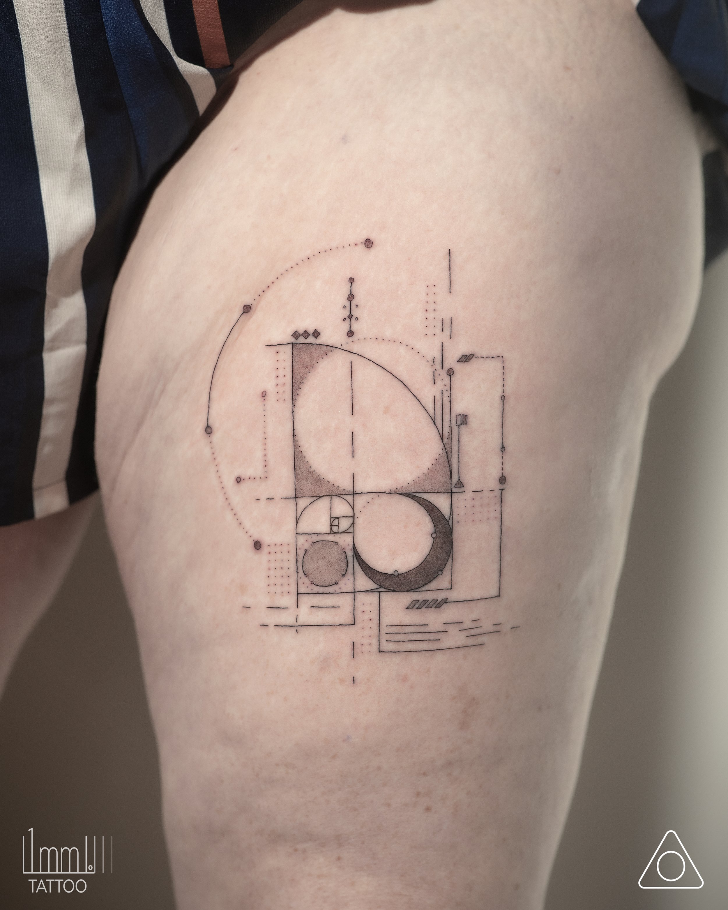 Geometric Golden Spiral Tattoo on Arm