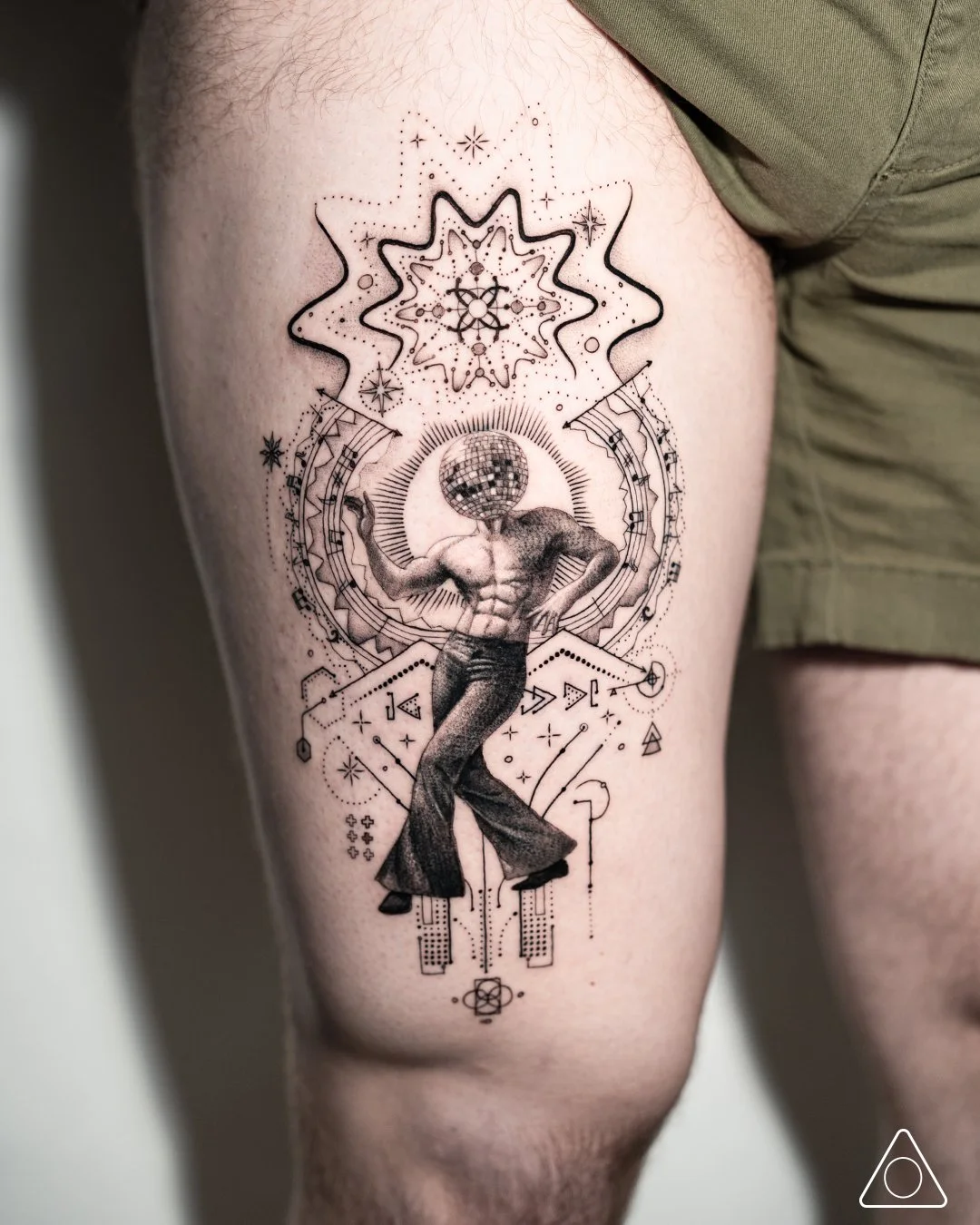 Sonic Rebirth thigh tattoo completed at Speakeasy Tattoo in Chicago, Illinois, featuring a disco ball headed dancer with geometric abstraction, sacred geometry, and fine line black and grey detail.