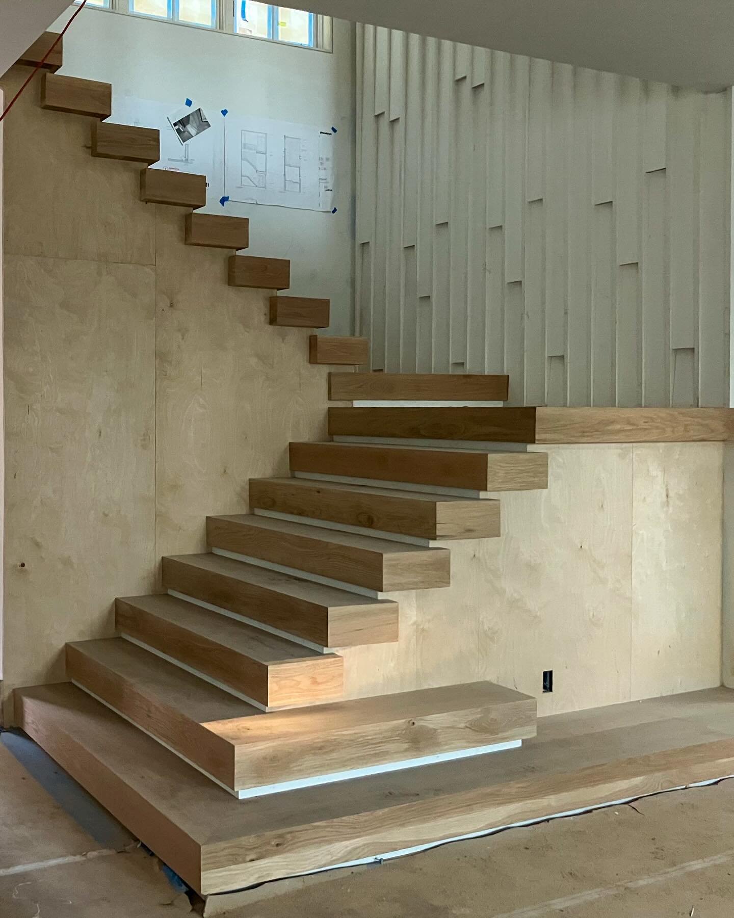 Stairs are often considered to be the sculptural centerpiece of the home. Our Hilton Head vacation home uses thick treads that transition to a bench on the last tread, emphasizing the cascading effect from the top down. 
.
Architect: @phenotypearchit