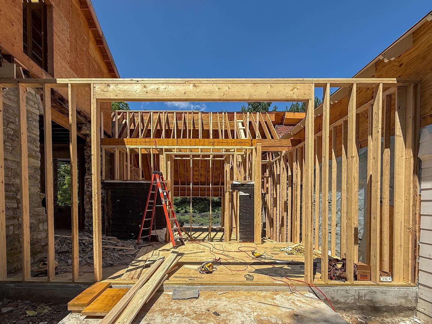 Framing well under way at our Wayne carriage house renovation. 

In addition to a full gut renovation, we designed a new entry that links the north and south ends of what was a carriage house and garage/storage with a new connector that allows our cl