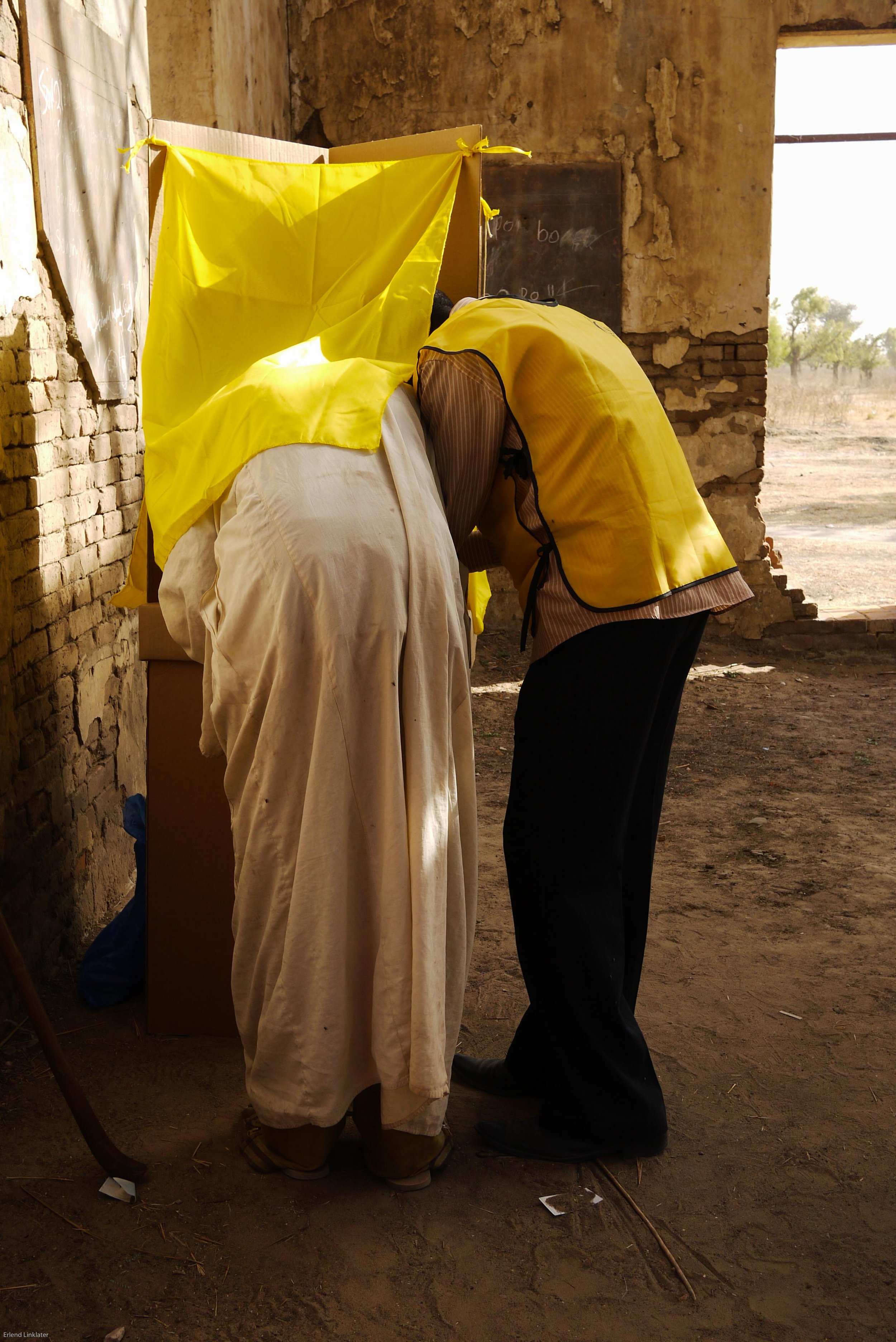A man receives assistance from a polling station worker to cast his vote in the referendum to determine whether South Sudan should become an independent country and separate from Sudan. For many, this was the first time that they had the opportunity