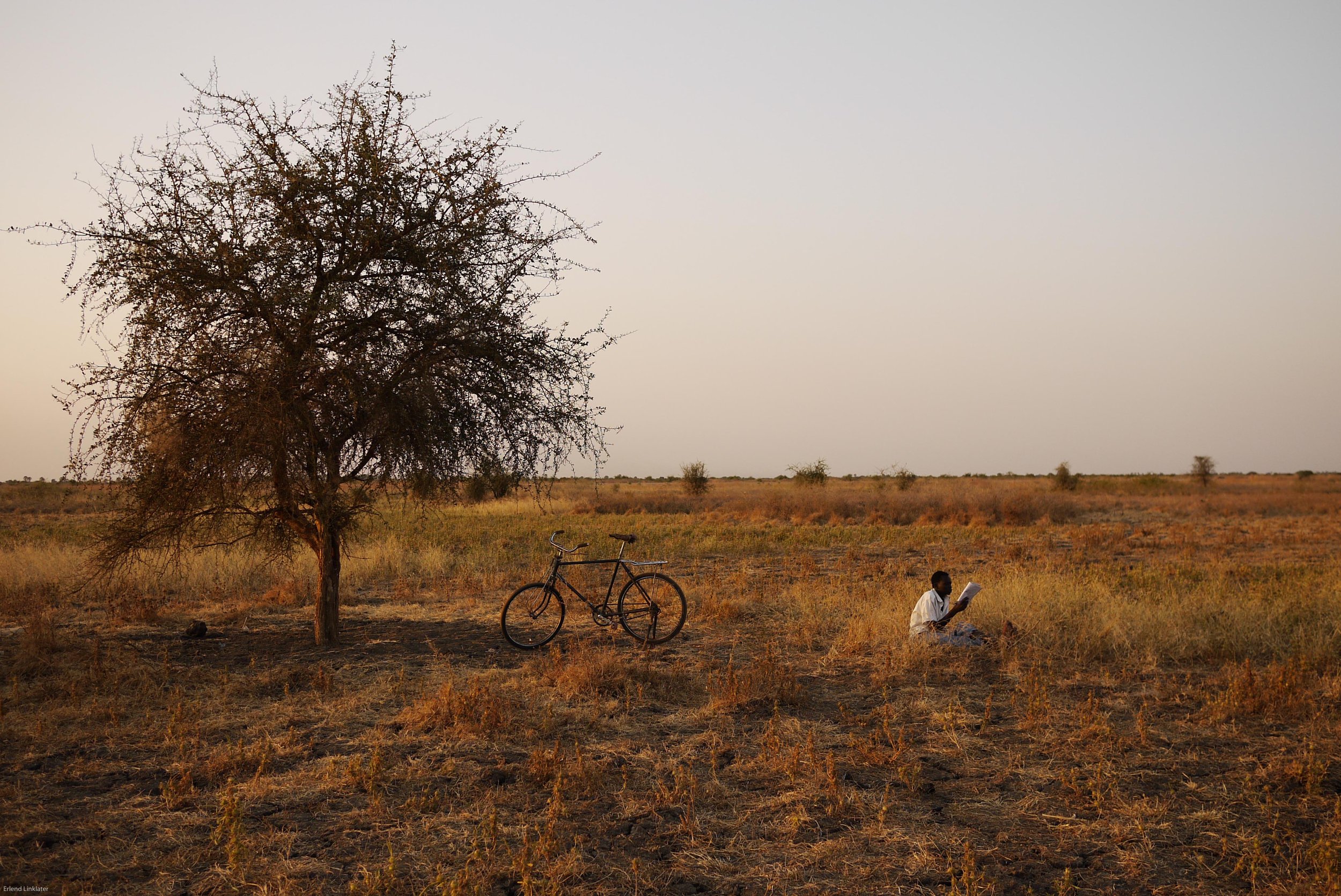 A boy finds a quiet spot to study on the outskirts of Malakal, 2011.
