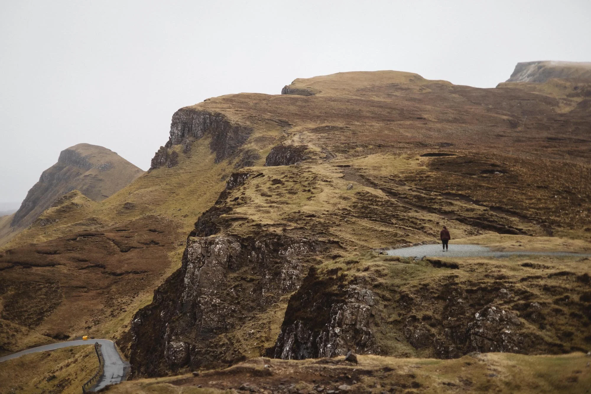 Sarah Petty stands on a small overlook in the Quiraing mountains, Isle of Skye