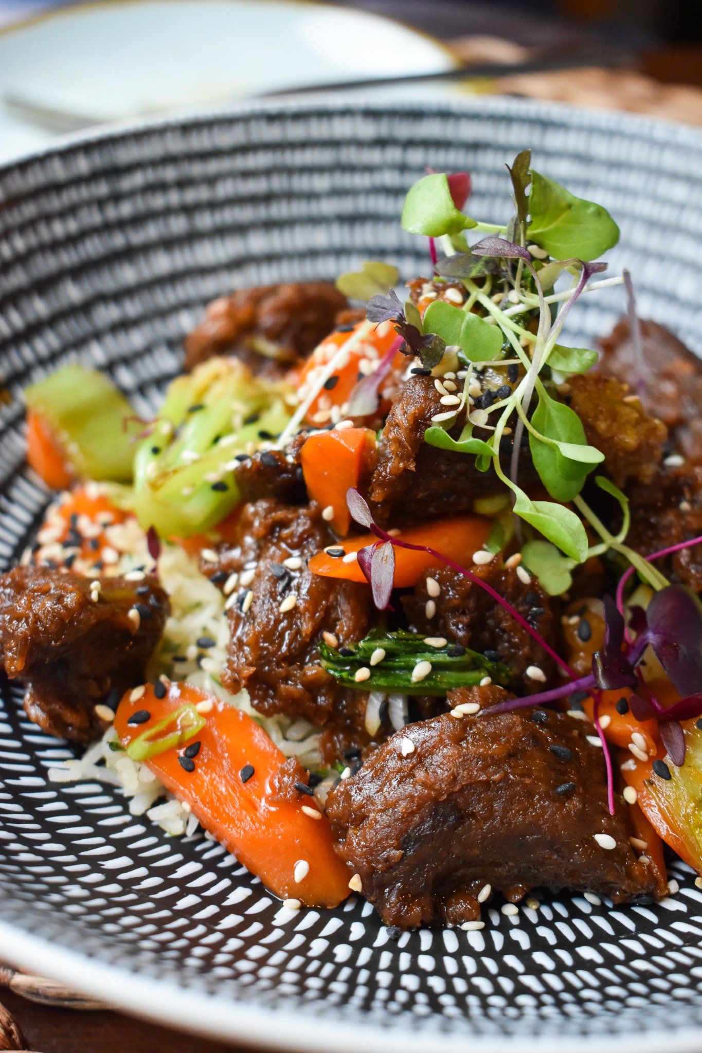 Plant-forward seasonal entrée at Equinox Restaurant in Washington, DC, featuring locally sourced ingredients and chef-driven cuisine.