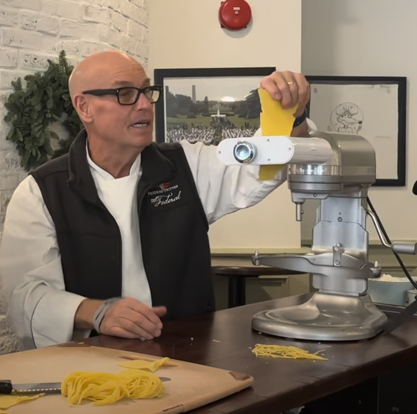 Chef Todd Gray doing a pasta making demo with a private event group