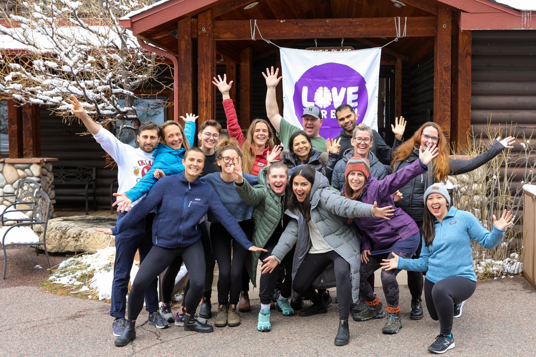 Group photo of happy people at a Love Your Brain retreat.