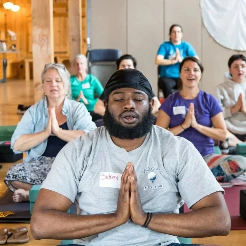 BIPOC man does yoga and meditates