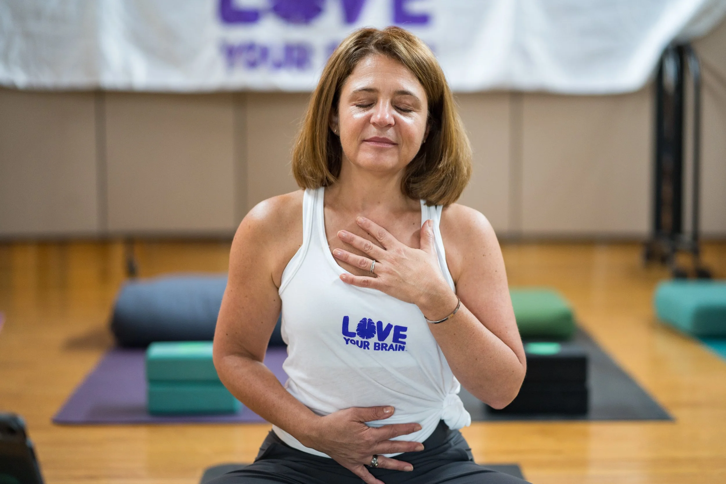 A person practicing meditation while seated