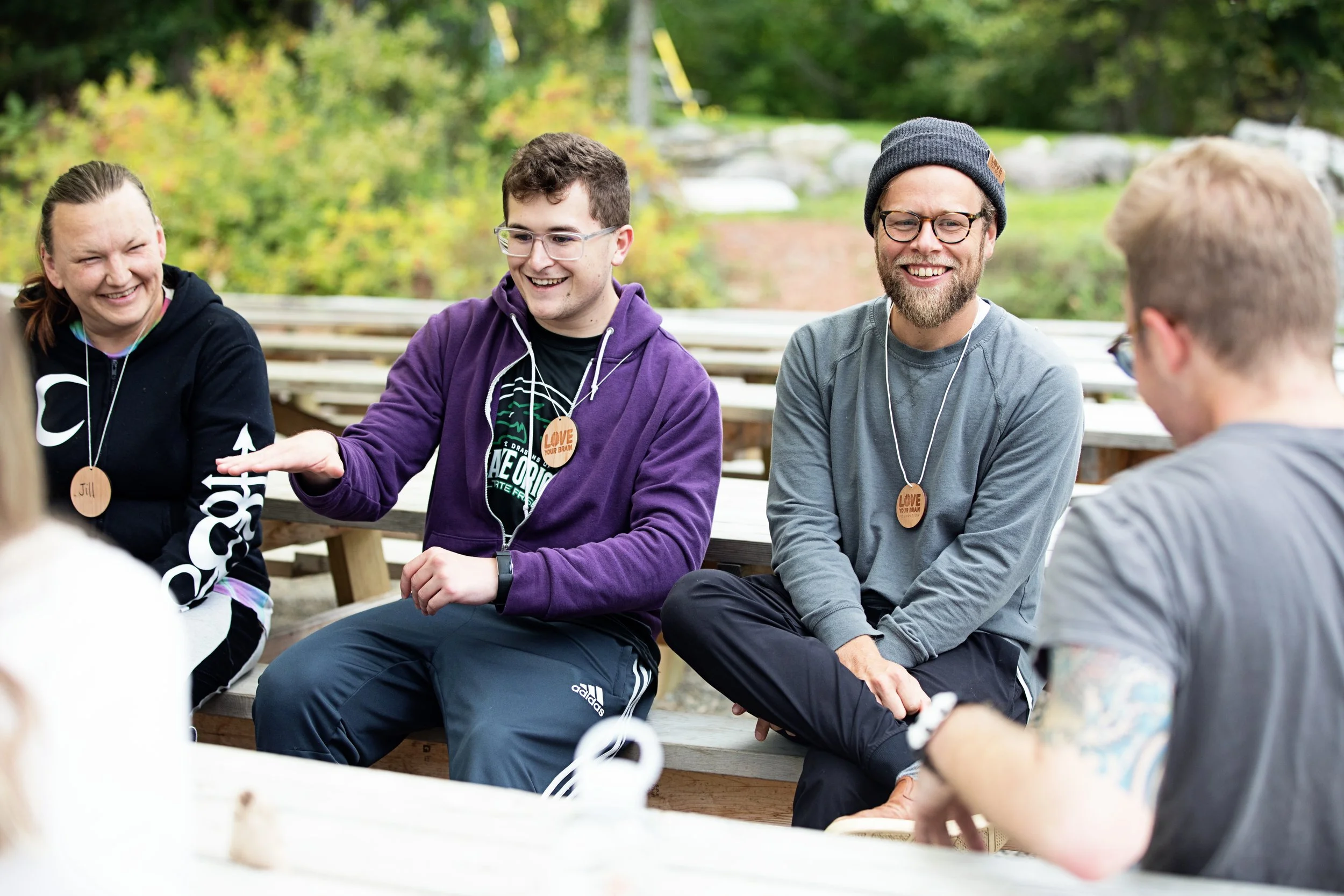 People smiling at a brain injury retreat.