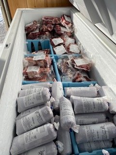 Chest freezer full of frozen beef