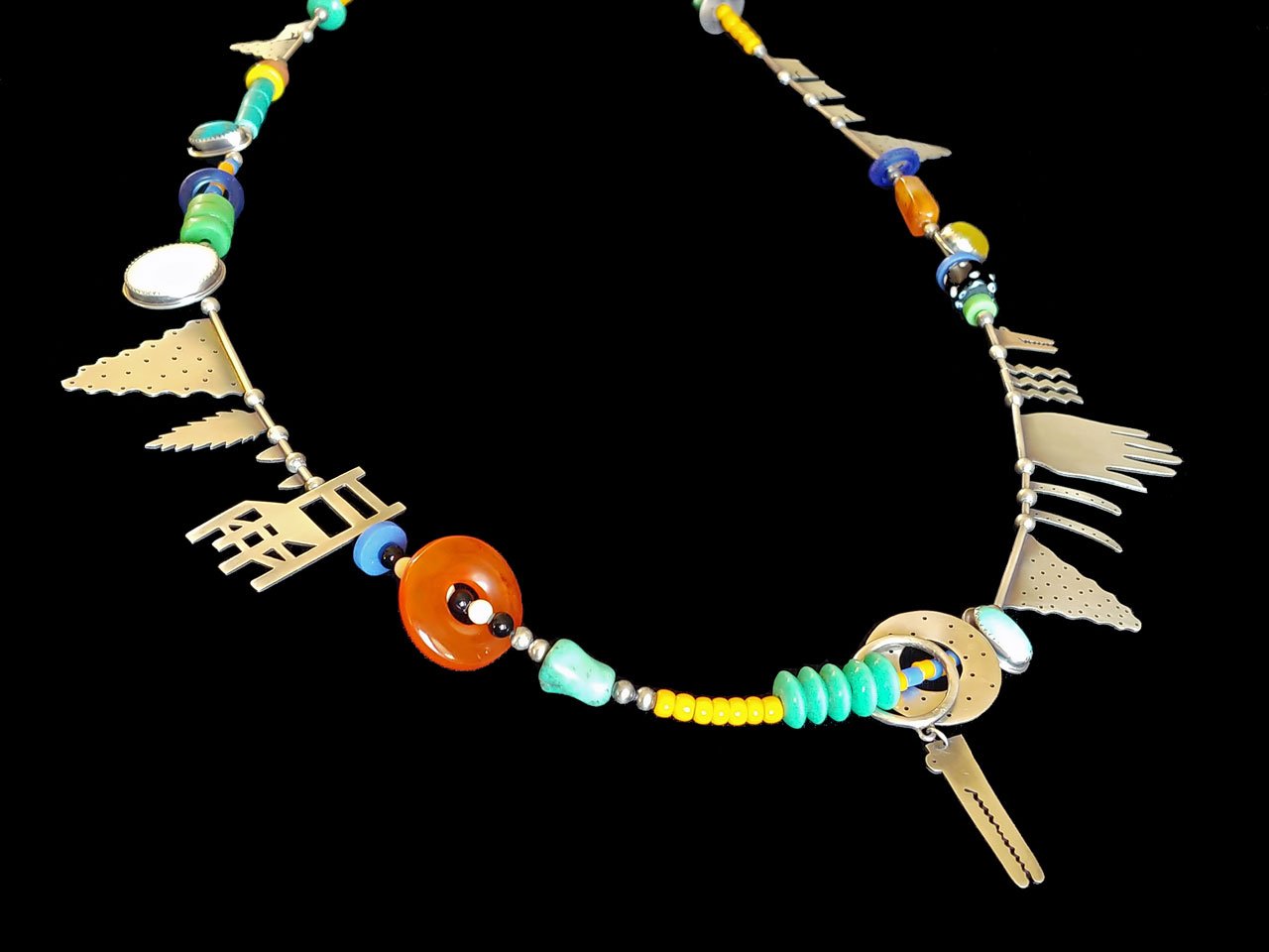   It is Just a Little Story Necklace  of sterling silver, antique African glass beads, carnelian, turquoise, marble, agate, bone, obsidian, mother of pearl; fabricated, bezel set, 1980s. 