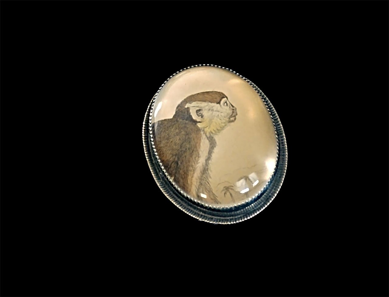   Little Friend Ring  of vintage monkey print, sterling silver, and quartz crystal; formed, soldered, bezel set, 2017. 