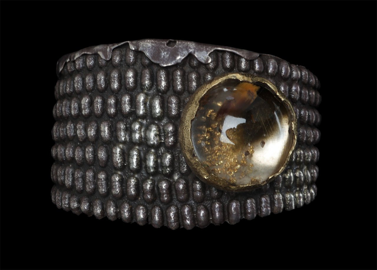   Silver Bracelet  by Anthony Lovato, tufa cast silver and fabricated, with bezel set rutilated quartz.  