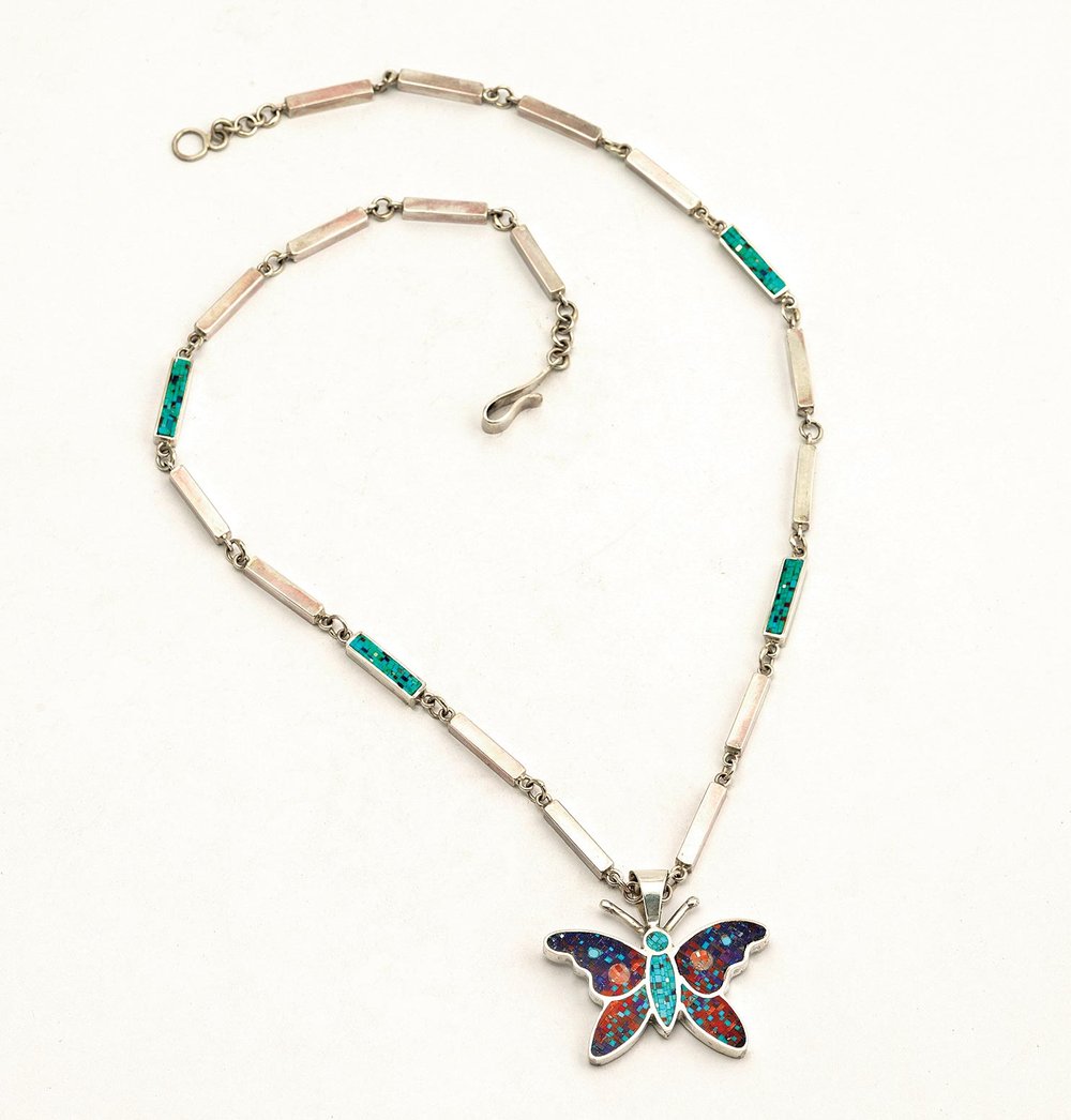  BUTTERFLY PENDANT of silver, lapis lazuli, sugilite, red and pink coral, red spiny oyster shell, red jasper, and mother of pearl; necklace: 51.0 centimeters long, pendant: 3.8 x 5.1 centimeters, 2023. This is the only butterfly necklace that the Cla