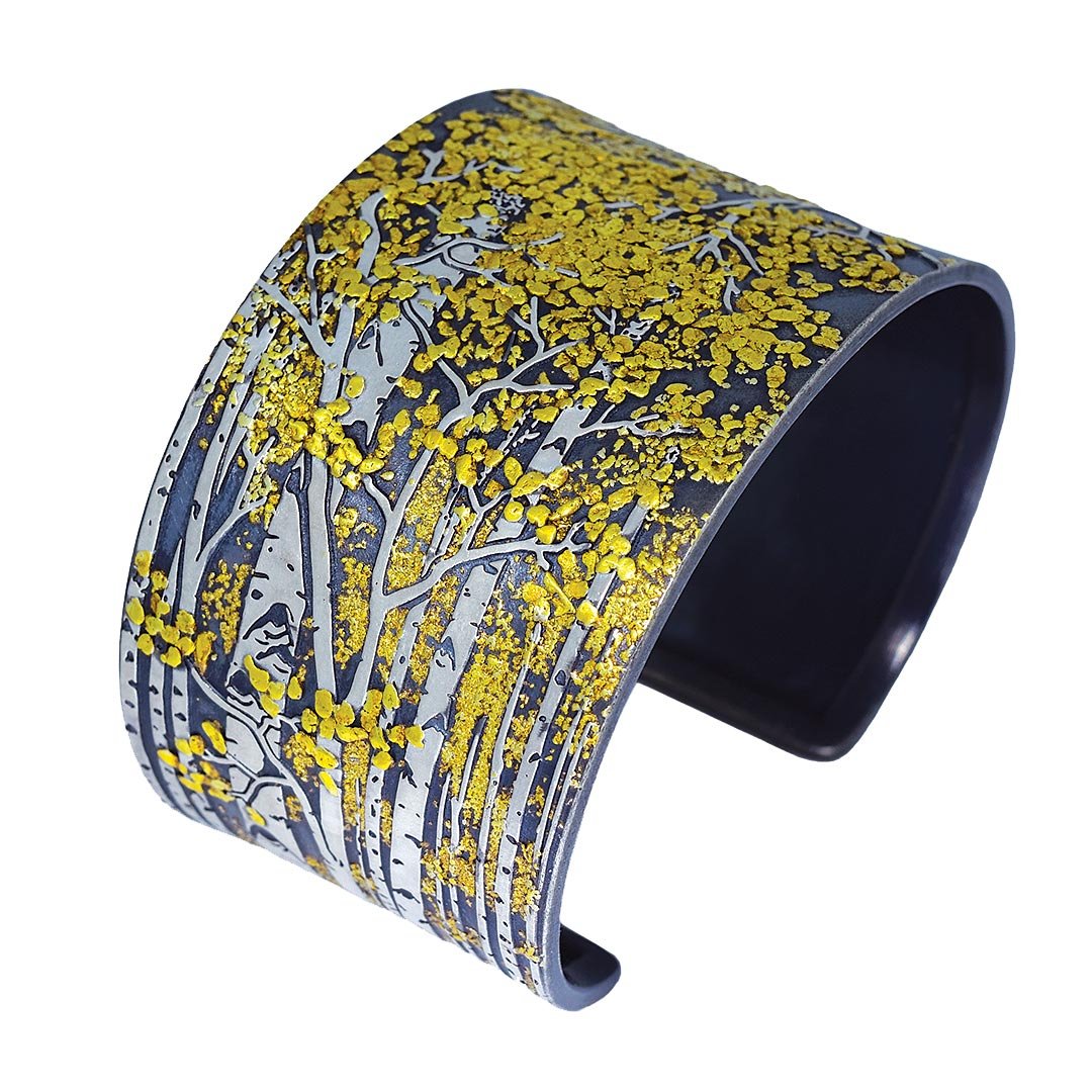  IN THE ASPEN GROVE CUFF of Argentium silver, fourteen karat white gold, twenty-two to twenty-three and a half karat placer gold fused to silver;&nbsp; hand-fabricated, carved, engraved, oxidized, 4.8 x 5.6 x 3.3 centimeters, 2023. 
