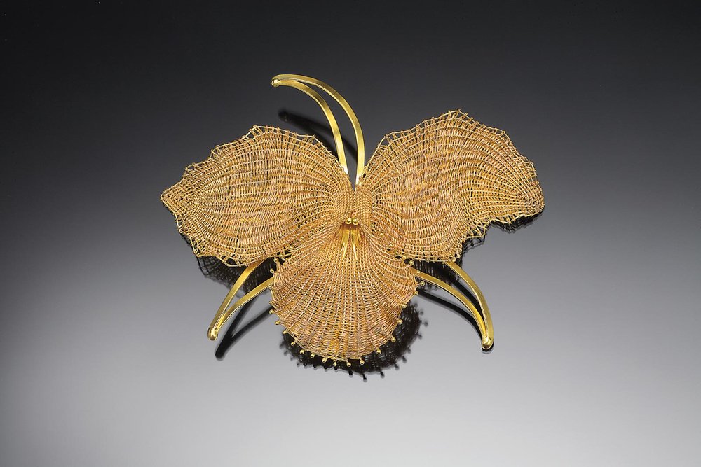  BROOCH #33 of eighteen and twenty-two karat gold; 9.5 × 12.1 × 2.5 centimeters, 2010.  Collection of the artist.  MARY LEE HU in her home in Seattle, Washington.  Photograph by Carolyn L. E. Benesh.  